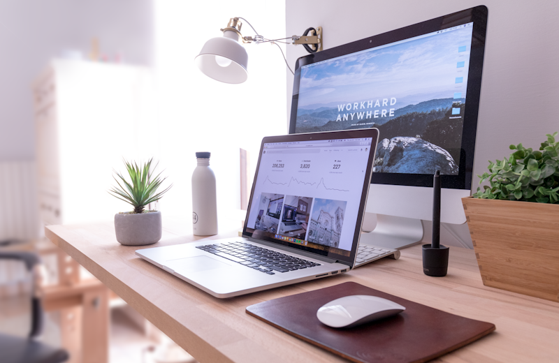 A desk with a laptop